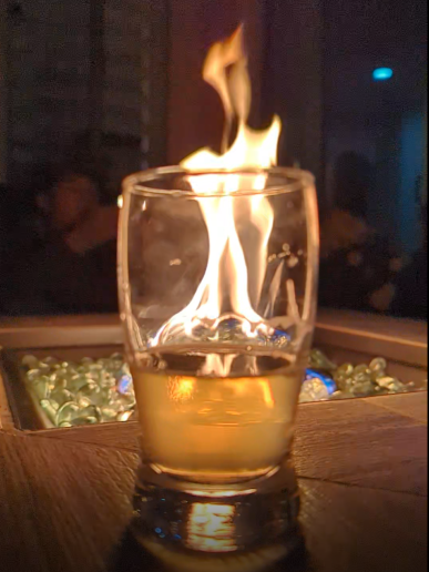 night, glass in front of flame